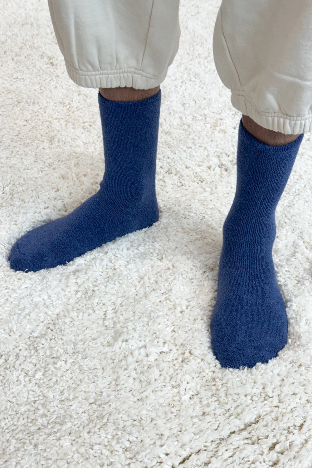 man in blue cozy cloud socks