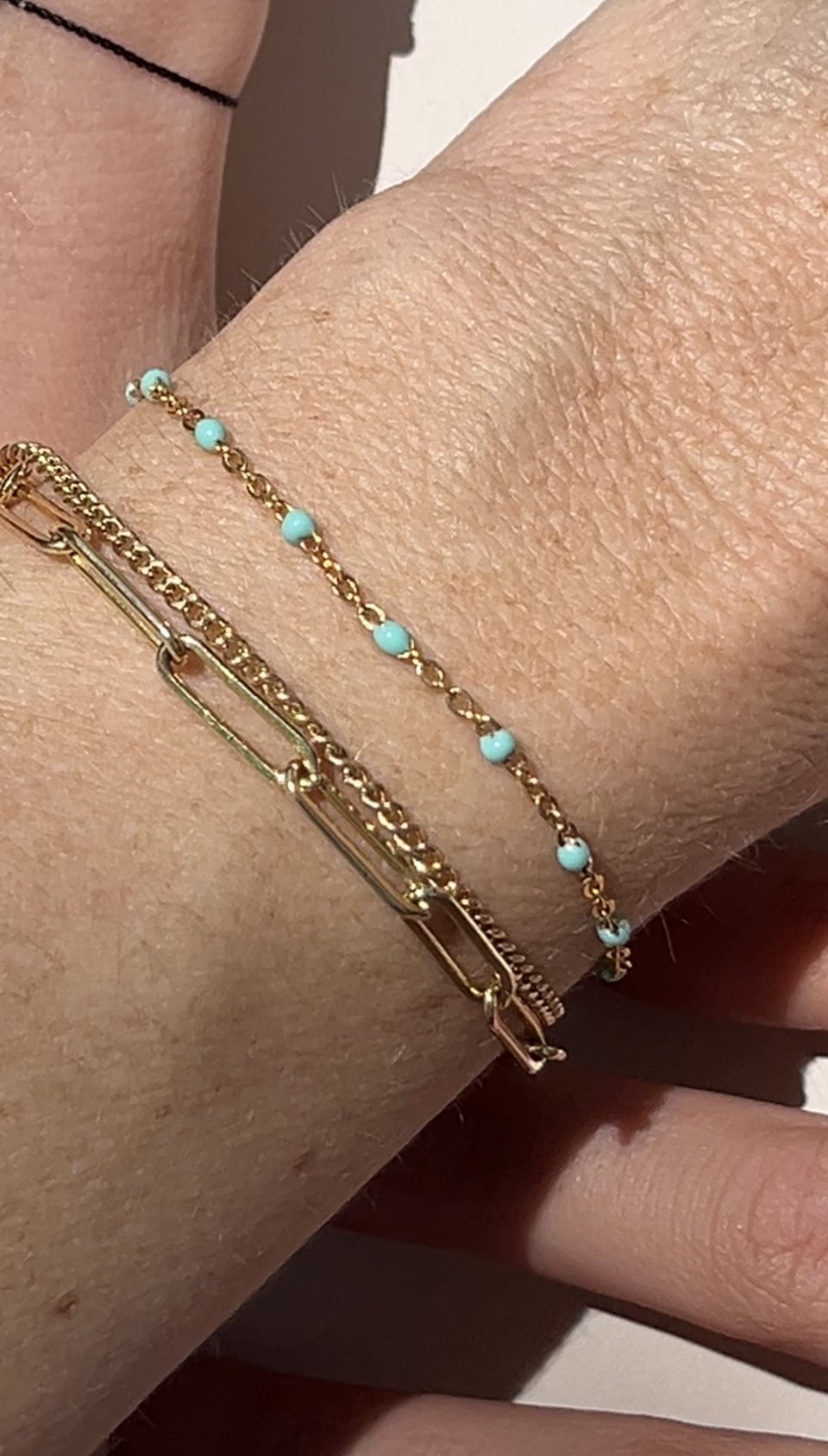 layered yellow gold-filled bracelets one with blue enamel beads