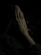 Nighttime bird’s-eye view of model in white pajama shorts showing the Thalken® sparkle mantra bracelet with the Moon Charged bracelet