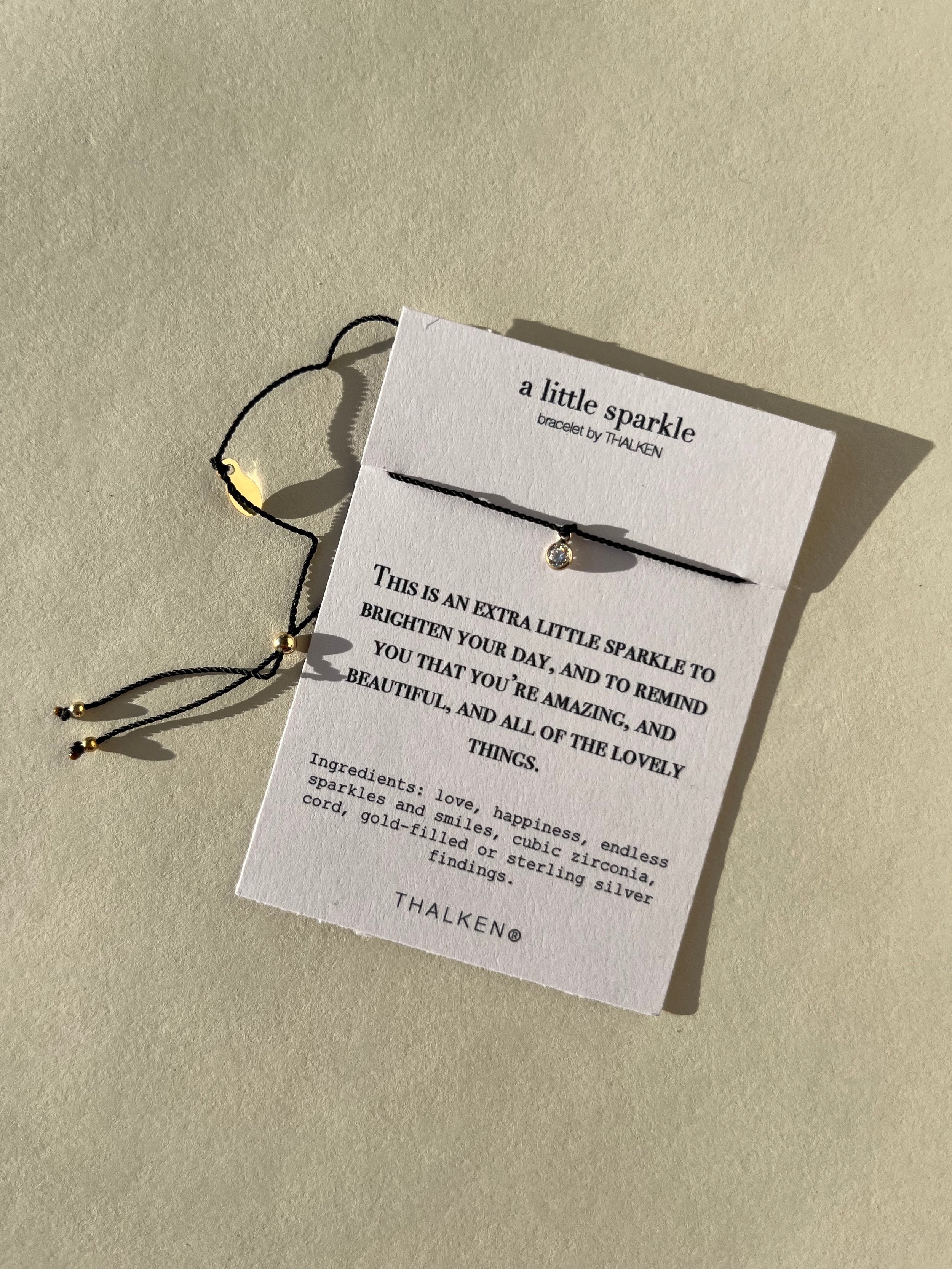 Thalken® sparkle mantra bracelet displayed on a bracelet card with the written intention and meaning