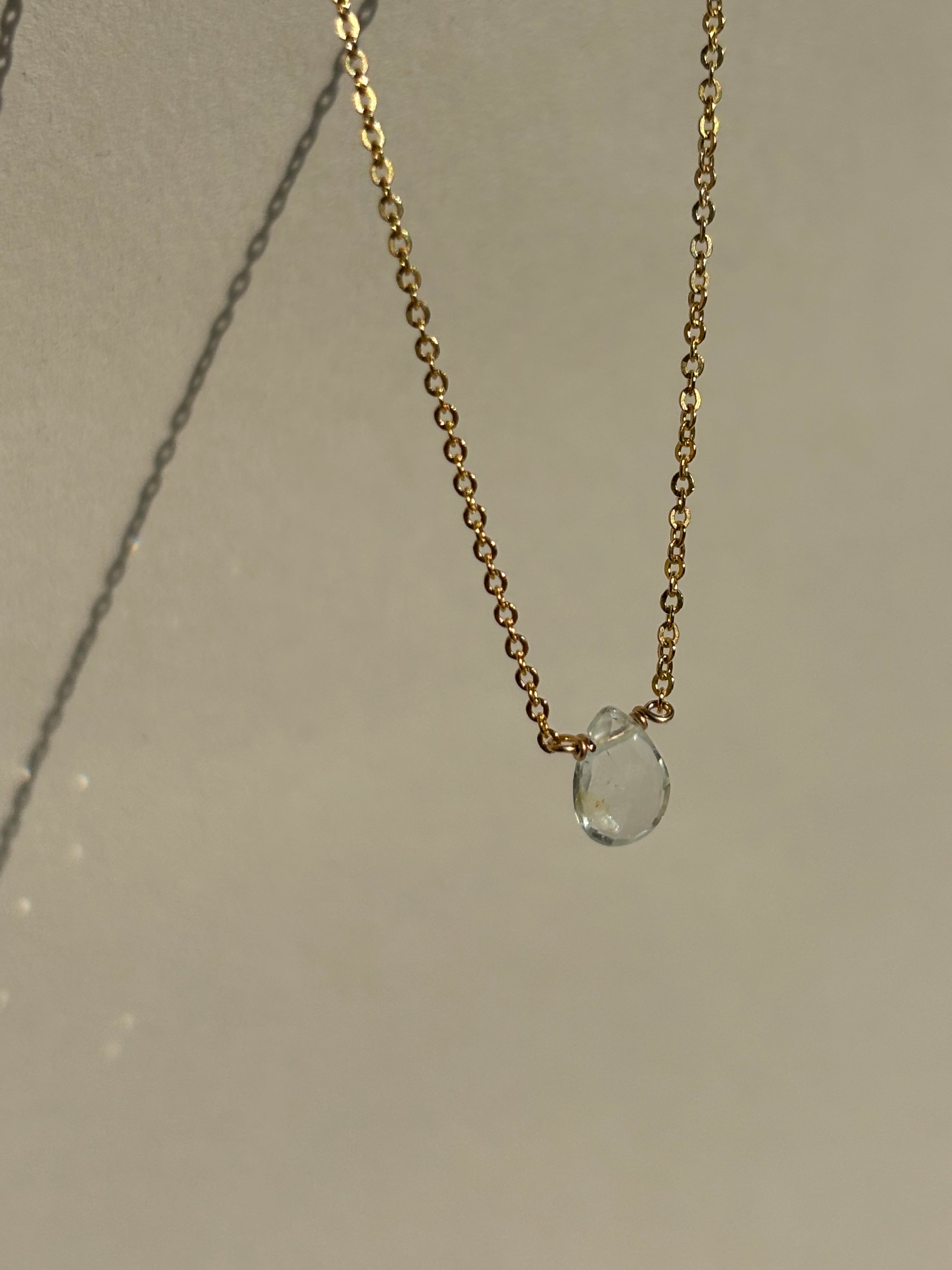 Natural blue aquamarine drop necklace in yellow gold-filled suspended in air