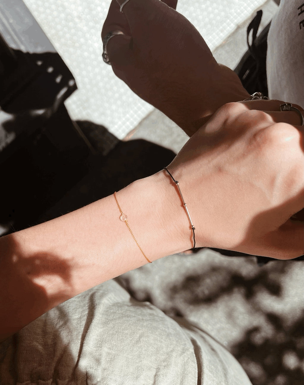 Close-up of the bracelet on model’s wrist, styled with the Thalken® Balance Bracelet