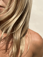 Model wearing the yellow gold-filled Bar Necklace layered with the Perfect Curb Chain Necklace