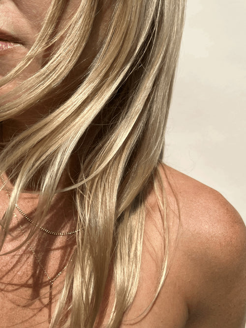 Model wearing the yellow gold-filled Bar Necklace layered with the Perfect Curb Chain Necklace