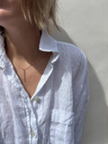 Model wearing minimalist Thalken bar necklace in the 16" option