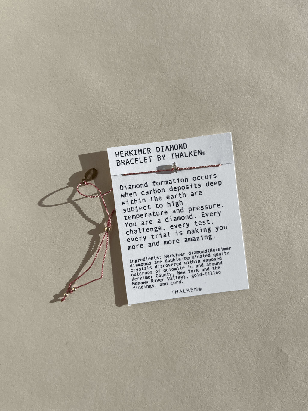 Herkimer diamond bracelet displayed on mantra bracelet card against a neutral backdrop