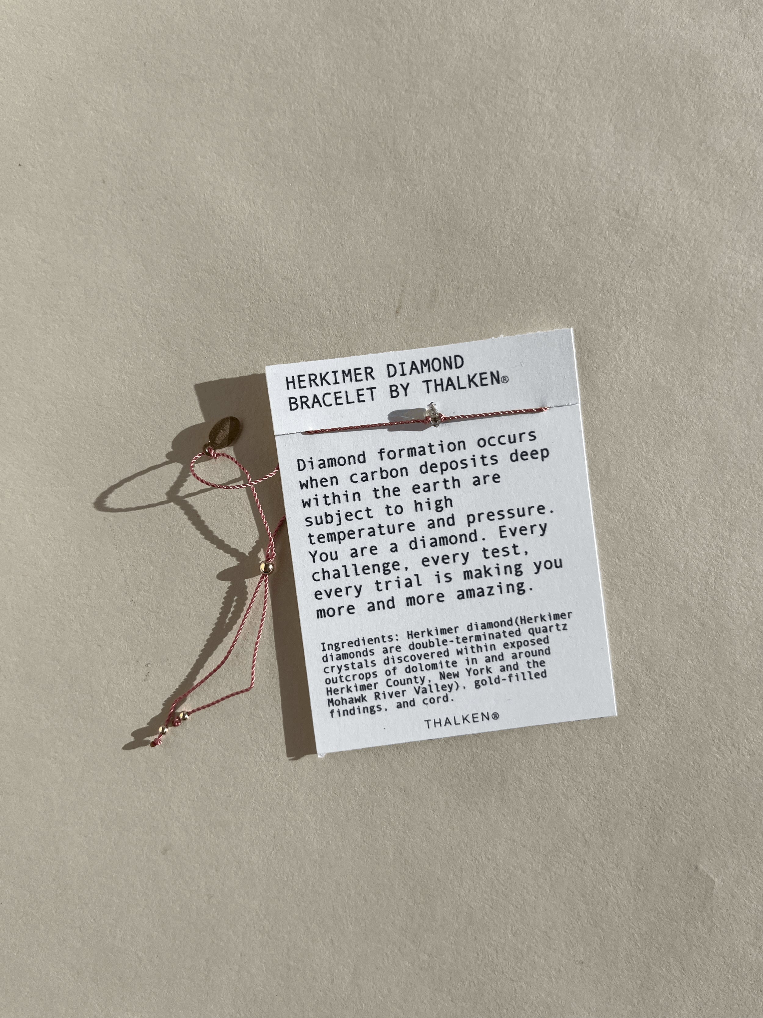 Herkimer diamond bracelet displayed on mantra bracelet card against a neutral backdrop