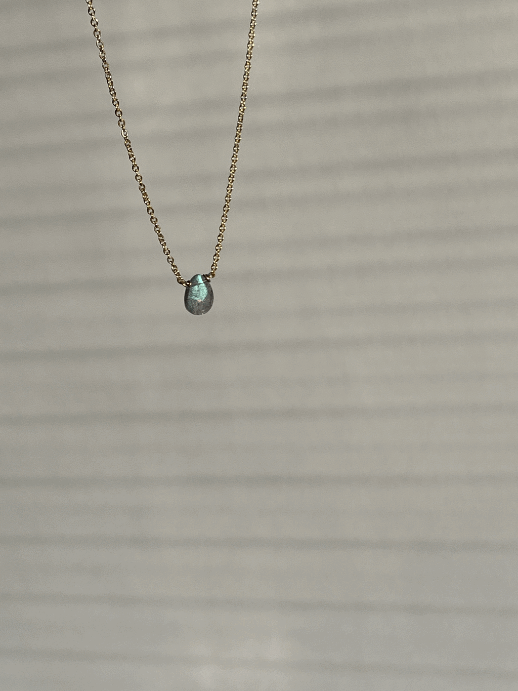 Yellow gold-filled dainty labradorite drop necklace suspended product shot by Thalken