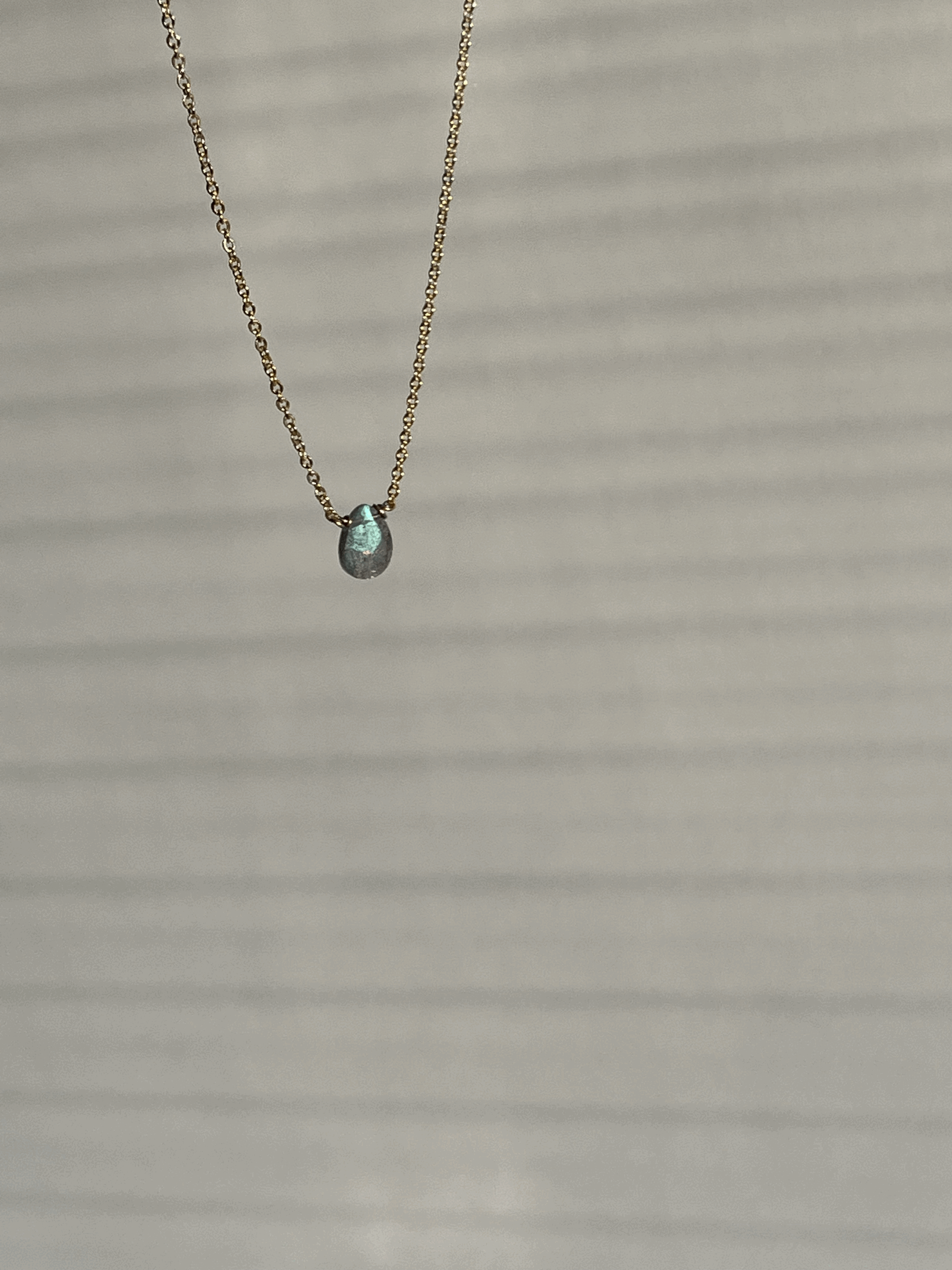 Yellow gold-filled dainty labradorite drop necklace suspended product shot by Thalken