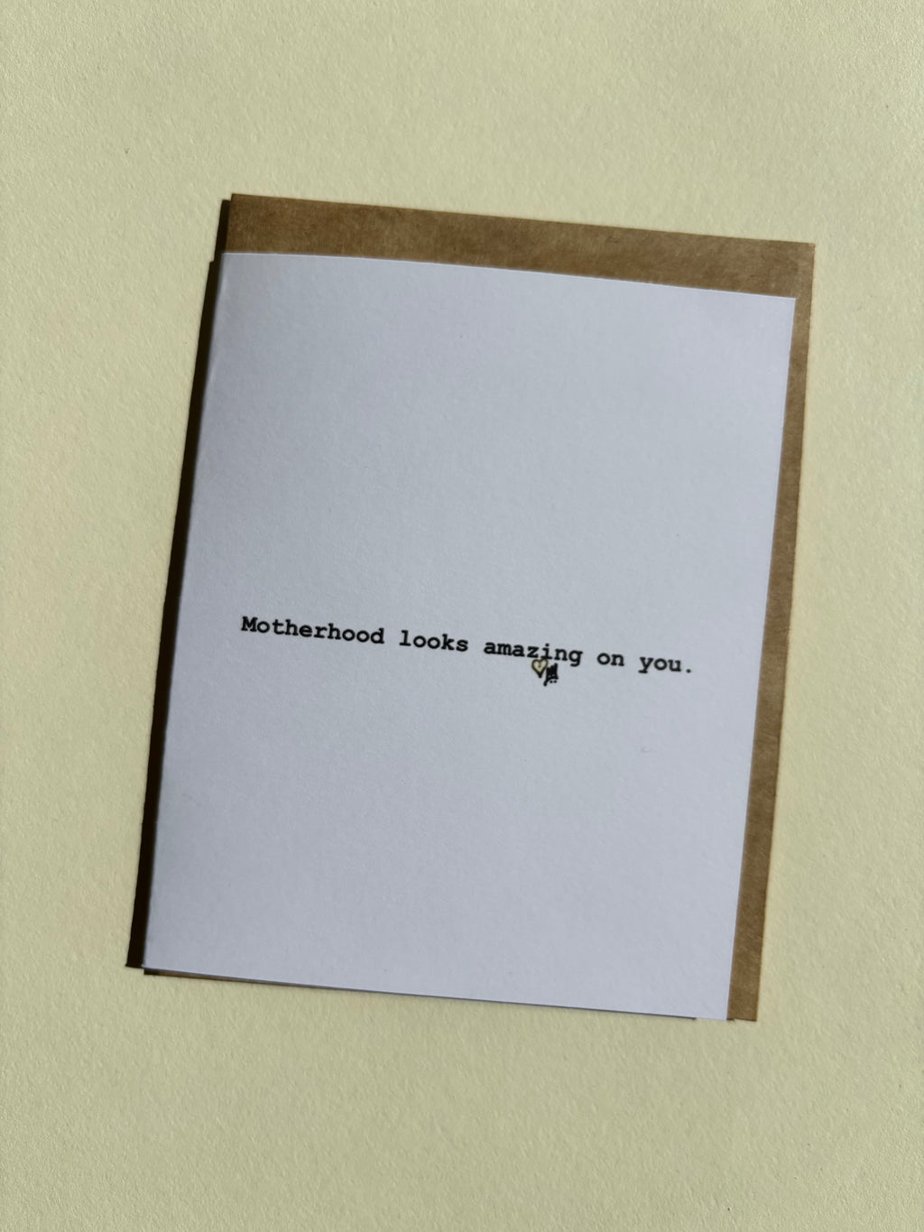 Greeting card that says "Motherhood looks amazing on you."