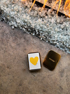 gold tin THALKEN card case, with conversation deck in the case with a yellow heart on the cards